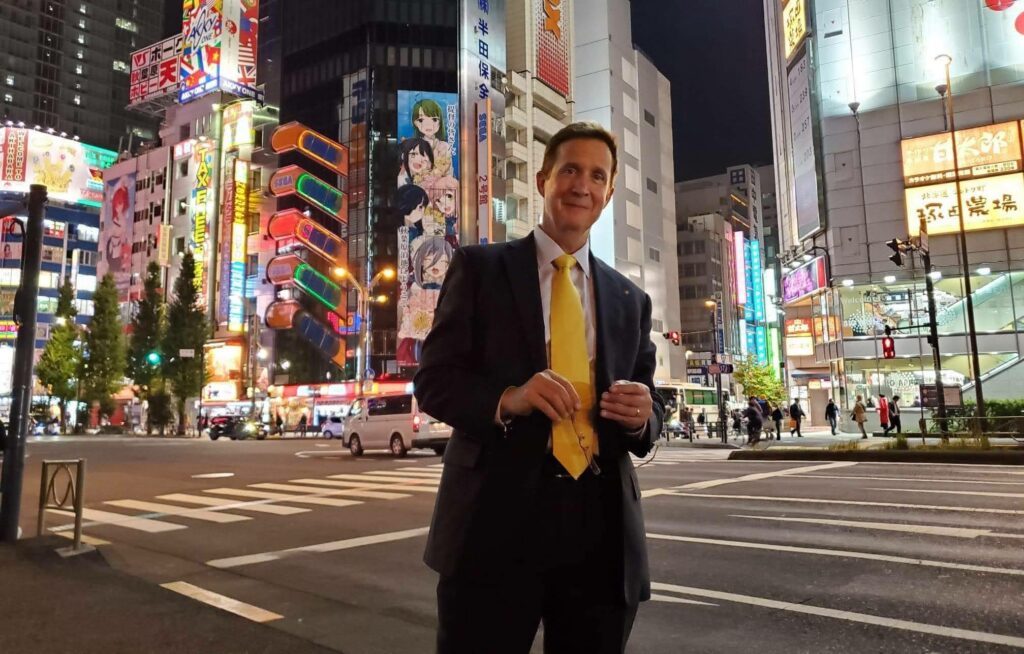 Lawrence Serven standing in front of a popular crossroads in Akihabara, Japan.